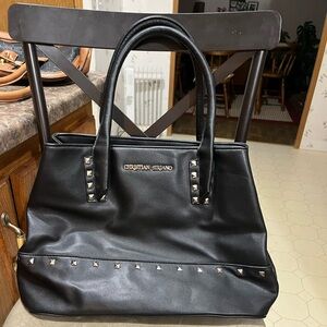 Beautiful black with pinstripe liner Christian Soriano bag.